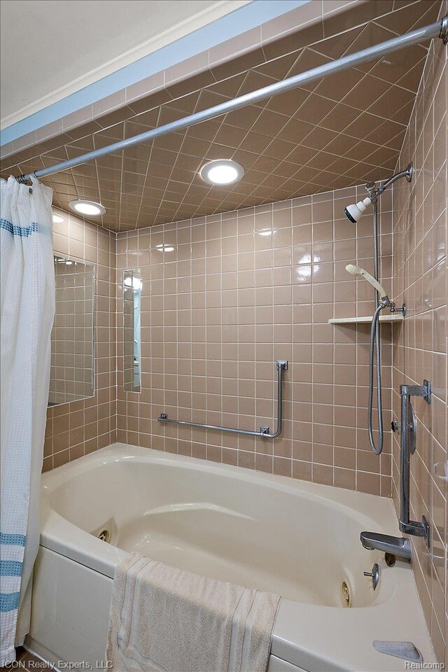 8569 Cooley Beach Dr, White Lake, MI 48386 - full bathroom featuring a combined bath / shower with jetted tub and recessed lighting