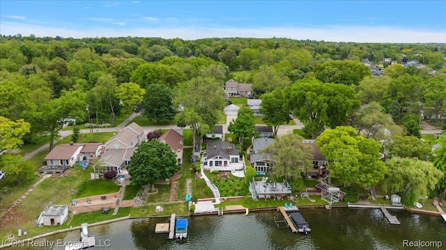8569 Cooley Beach Dr, White Lake, MI 48386 - aerial overview of property's location with nearby suburban area, a nearby body of water, and a heavily wooded area