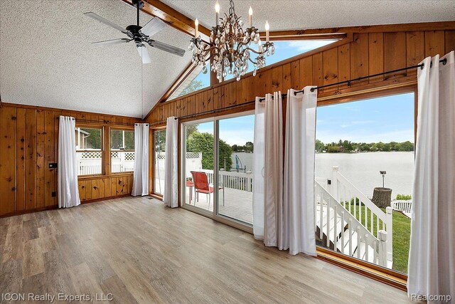 8569 Cooley Beach Dr, White Lake, MI 48386 - unfurnished sunroom with a water view and a chandelier