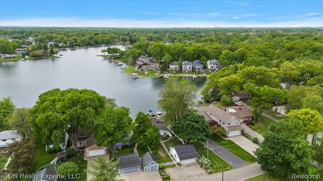 8569 Cooley Beach Dr, White Lake, MI 48386 - aerial view of property and surrounding area featuring a nearby body of water, nearby suburban area, and a heavily wooded area