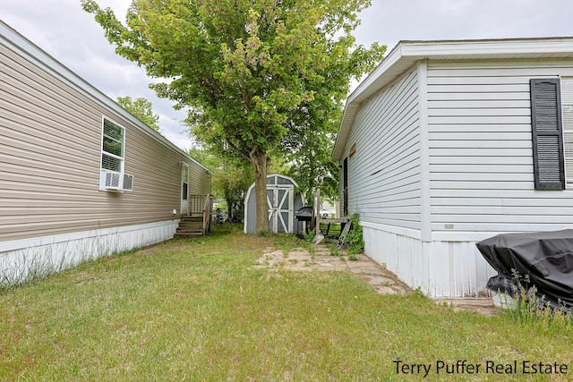1281 E Pontaluna Rd Lot 113, Norton Shores, MI 49456 - view of green lawn featuring cooling unit