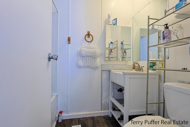 1281 E Pontaluna Rd Lot 113, Norton Shores, MI 49456 - full bathroom featuring toilet, vanity, wood finished floors, and bathtub / shower combination