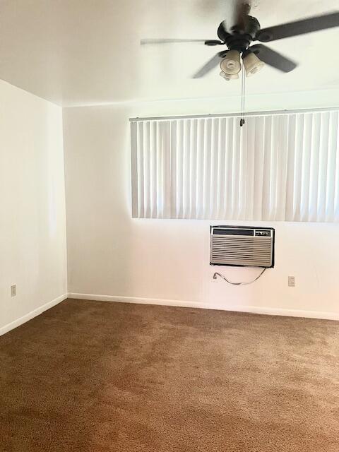 19160 Winston St Unit 206, Detroit, MI 48219 - carpeted empty room featuring an AC wall unit, ceiling fan, and baseboards