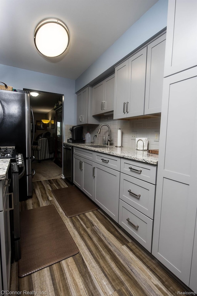 1660 River Rd Unit 52, Marysville, MI 48040 - kitchen featuring a sink, gray cabinetry, dark wood-style floors, black dishwasher, and tasteful backsplash