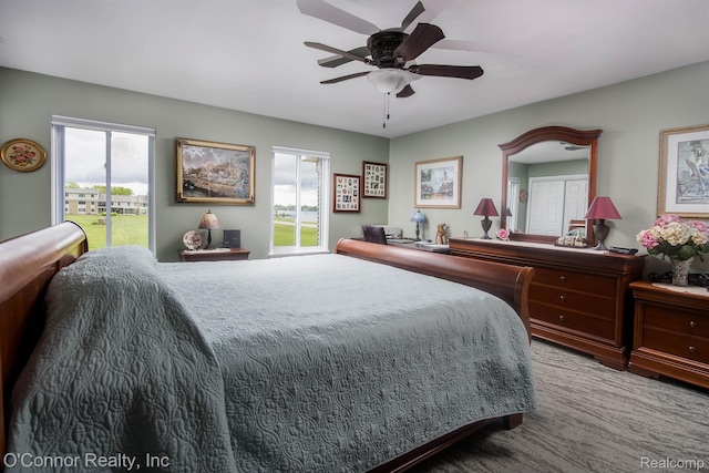 1660 River Rd Unit 52, Marysville, MI 48040 - carpeted bedroom featuring access to exterior and ceiling fan