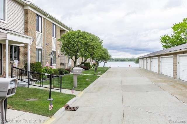 1660 River Rd Unit 52, Marysville, MI 48040 - view of property's community featuring a water view, community garages, and a lawn