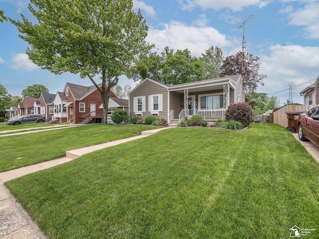 619 Parkwood Ave, Monroe, MI 48162 - view of front of home with a porch and a front lawn