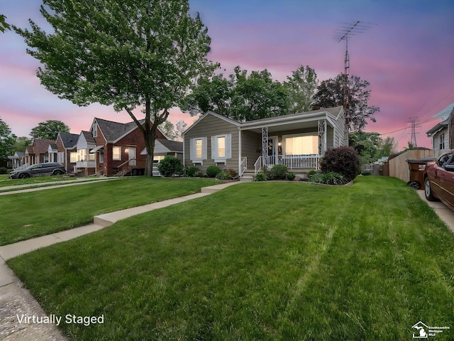 619 Parkwood Ave, Monroe, MI 48162 - view of front facade with covered porch and a front lawn