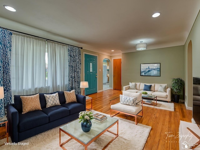 619 Parkwood Ave, Monroe, MI 48162 - living room with arched walkways, wood finished floors, recessed lighting, and baseboards