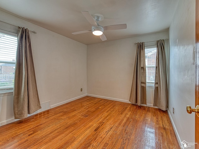 619 Parkwood Ave, Monroe, MI 48162 - spare room featuring light wood-style flooring, a ceiling fan, and baseboards