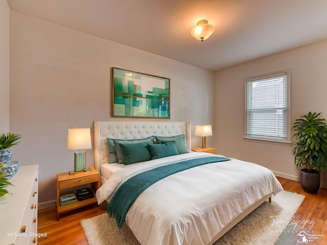 619 Parkwood Ave, Monroe, MI 48162 - bedroom with light wood-type flooring and baseboards