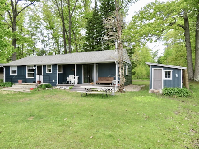6248 Howard St, Gladwin, MI 48624 - rear view of house featuring a lawn