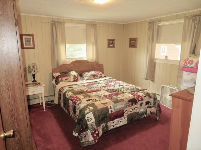 6248 Howard St, Gladwin, MI 48624 - bedroom with carpet flooring, crown molding, a baseboard radiator, and wooden walls