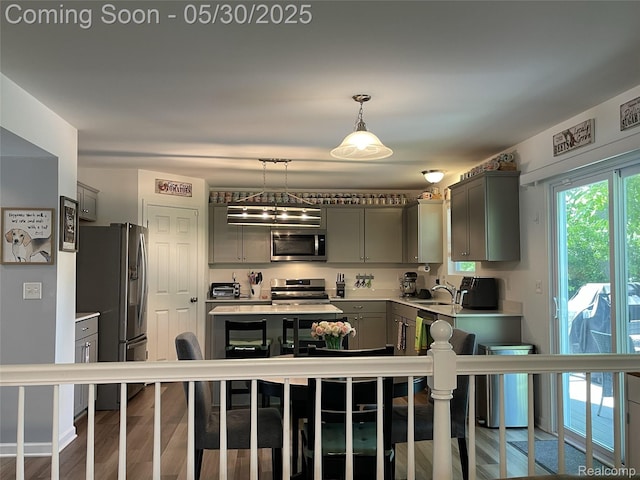 33500 Birchlawn, Westland, MI 48185 - kitchen featuring appliances with stainless steel finishes, gray cabinets, light countertops, decorative light fixtures, and a sink