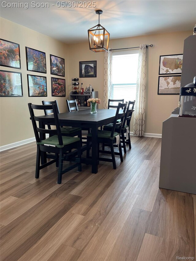 33500 Birchlawn, Westland, MI 48185 - dining area with a chandelier, light wood finished floors, and baseboards
