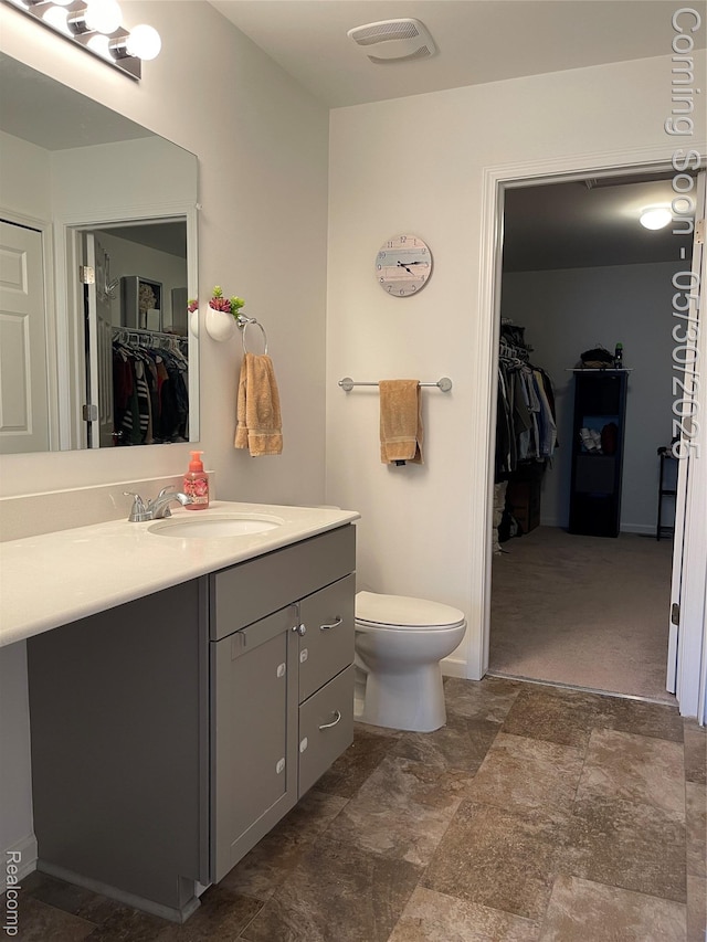 33500 Birchlawn, Westland, MI 48185 - bathroom with vanity, a spacious closet, and toilet