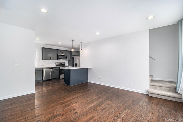 1508 Gardenia Ave, Royal Oak, MI 48067 - kitchen with stainless steel appliances, light countertops, dark wood finished floors, recessed lighting, and baseboards