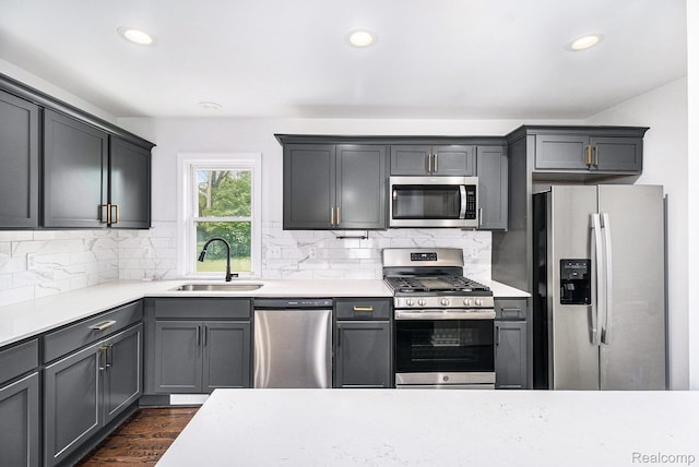 1508 Gardenia Ave, Royal Oak, MI 48067 - kitchen with stainless steel appliances, a sink, light countertops, recessed lighting, and decorative backsplash