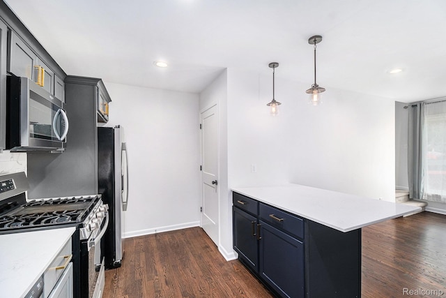 1508 Gardenia Ave, Royal Oak, MI 48067 - kitchen with stainless steel appliances, a peninsula, dark wood finished floors, light countertops, and pendant lighting