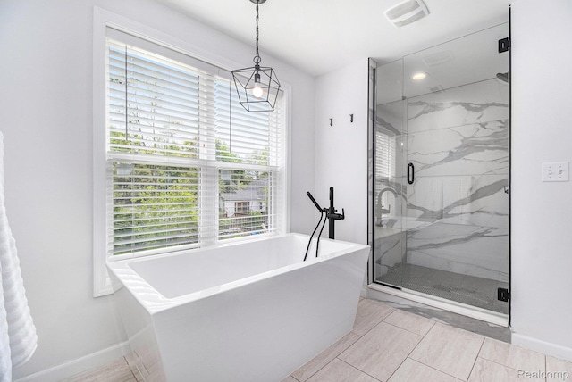 1508 Gardenia Ave, Royal Oak, MI 48067 - bathroom featuring a freestanding bath, a marble finish shower, a chandelier, and baseboards
