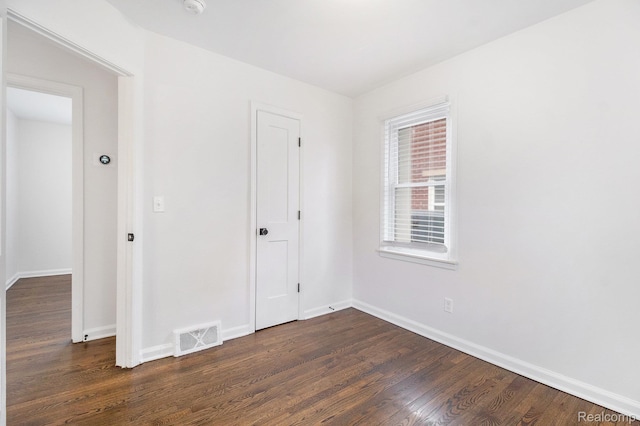 1508 Gardenia Ave, Royal Oak, MI 48067 - unfurnished bedroom featuring dark wood finished floors and baseboards