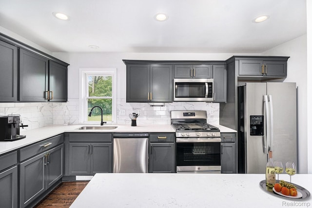 1508 Gardenia Ave, Royal Oak, MI 48067 - kitchen featuring appliances with stainless steel finishes, a sink, light countertops, recessed lighting, and decorative backsplash