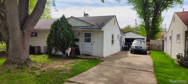 35519 Hazelwood St, Westland, MI 48186 - view of front facade featuring a shingled roof and a detached garage