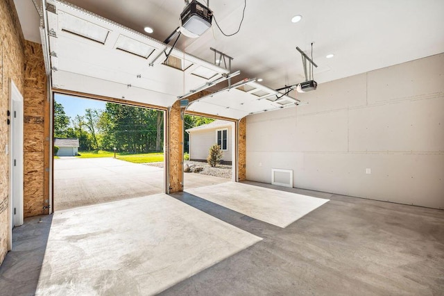 4530 Douglas Ter, Coloma, MI 49038 - garage featuring a garage door opener and recessed lighting
