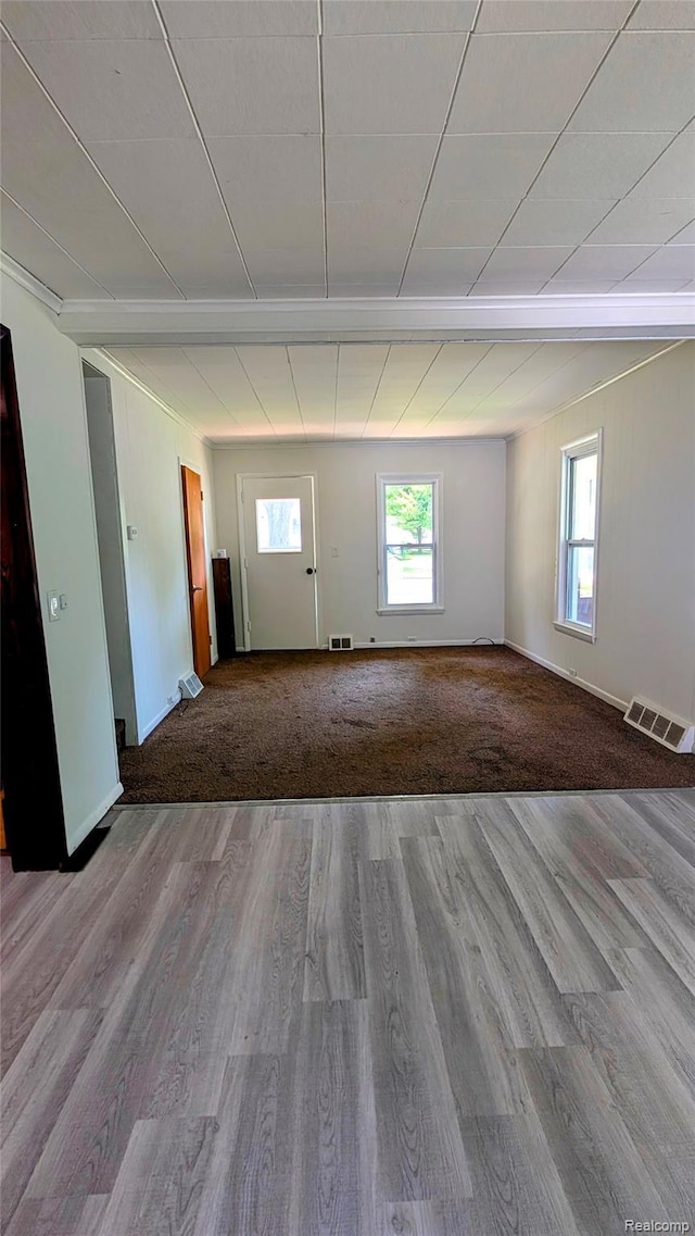 703 Queen St, Owosso, MI 48867 - spare room with wood finished floors and baseboards