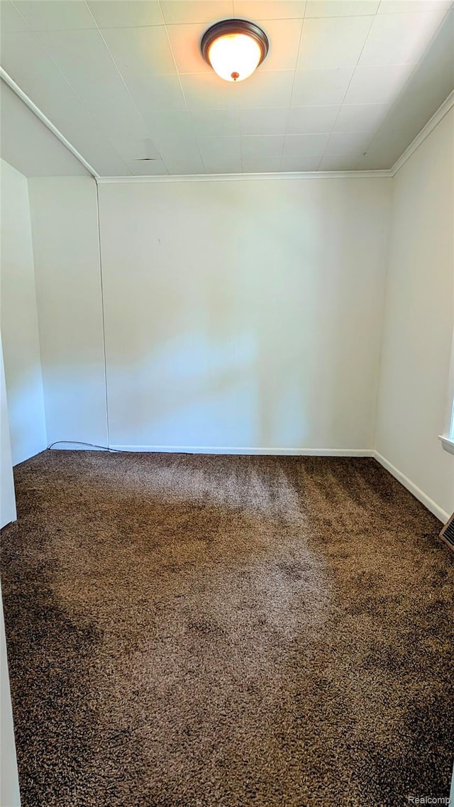 703 Queen St, Owosso, MI 48867 - carpeted empty room featuring crown molding