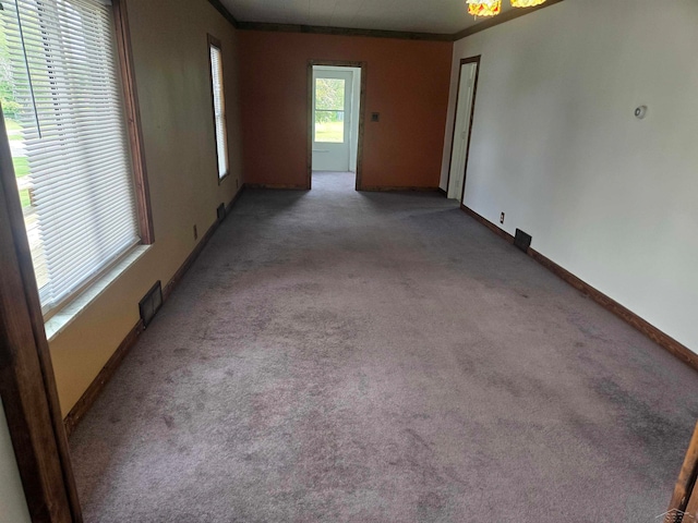 425 Wright St, Breckenridge, MI 48615 - carpeted spare room featuring baseboards and crown molding