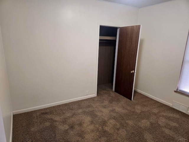 425 Wright St, Breckenridge, MI 48615 - unfurnished bedroom with carpet floors, baseboards, and a closet