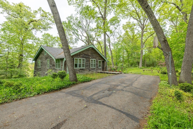 5436 Strawberry Lake Rd, Whitmore Lake, MI 48189 - view of front of property featuring driveway and a wooden deck