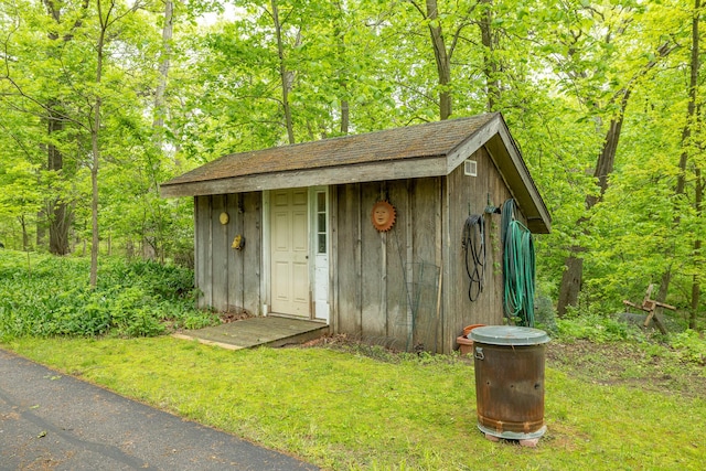5436 Strawberry Lake Rd, Whitmore Lake, MI 48189 - view of outdoor structure featuring a wooded view