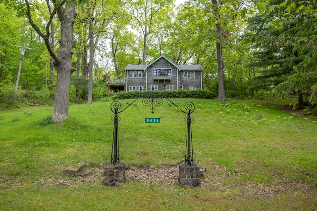5436 Strawberry Lake Rd, Whitmore Lake, MI 48189 - view of front of home with a chimney and a front lawn