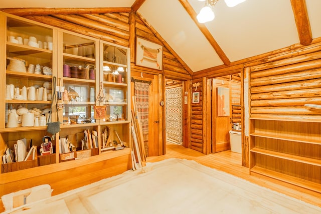 5436 Strawberry Lake Rd, Whitmore Lake, MI 48189 - hall featuring log walls, wood finished floors, and high vaulted ceiling