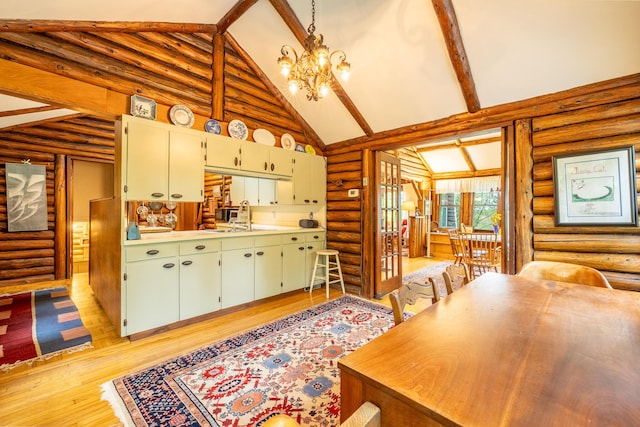 5436 Strawberry Lake Rd, Whitmore Lake, MI 48189 - kitchen with rustic walls, a sink, a chandelier, light wood-style flooring, and light countertops
