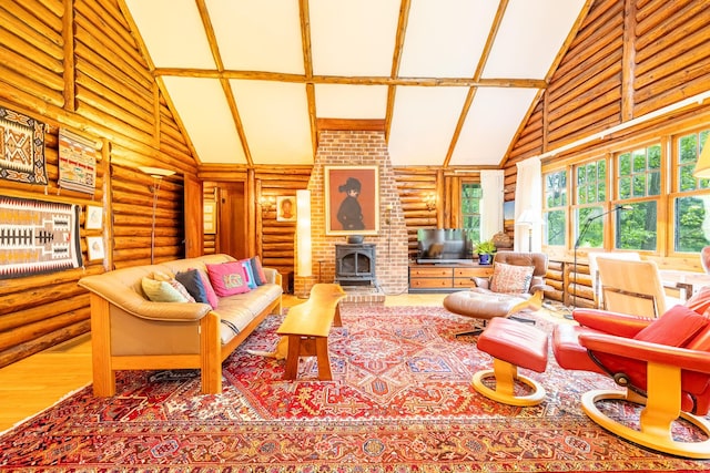 5436 Strawberry Lake Rd, Whitmore Lake, MI 48189 - living area with rustic walls, high vaulted ceiling, beamed ceiling, and a wood stove