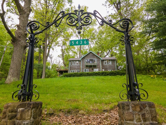 5436 Strawberry Lake Rd, Whitmore Lake, MI 48189 - view of front of house with a front yard and a chimney
