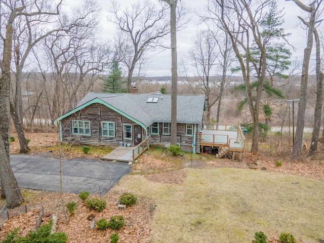 5436 Strawberry Lake Rd, Whitmore Lake, MI 48189 - view of front of house featuring a shingled roof, a chimney, log siding, stairs, and a deck