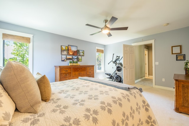 1050 Long Leaf Ct, Brighton, MI 48116 - bedroom with light carpet, ceiling fan, and baseboards