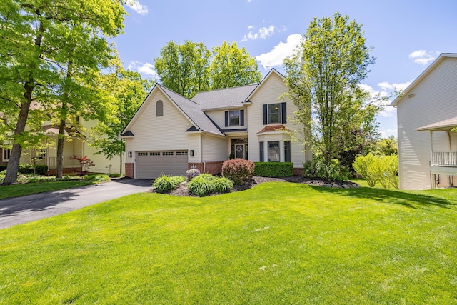 1050 Long Leaf Ct, Brighton, MI 48116 - view of front of property with driveway, brick siding, a front lawn, and roof with shingles