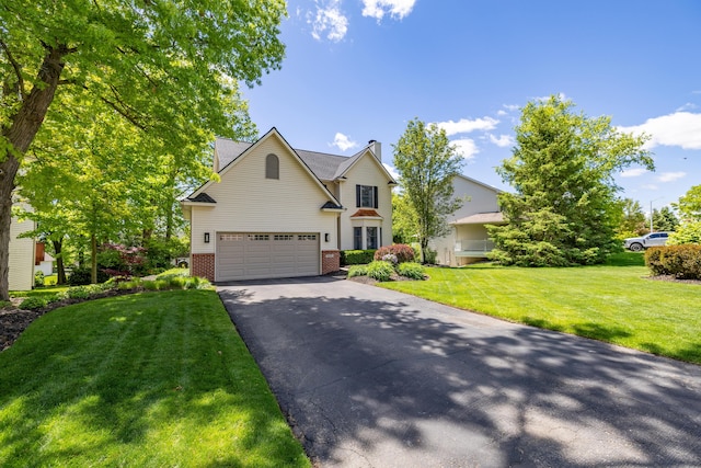 1050 Long Leaf Ct, Brighton, MI 48116 - traditional-style home featuring brick siding, asphalt driveway, a front lawn, an attached garage, and a chimney