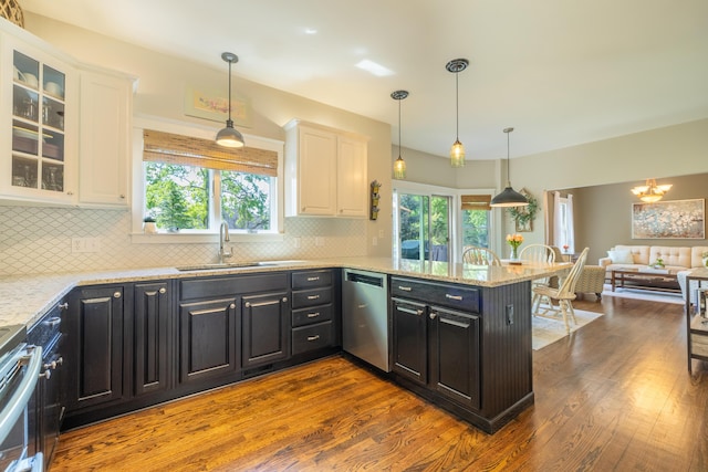 1050 Long Leaf Ct, Brighton, MI 48116 - kitchen featuring stainless steel appliances, a sink, white cabinets, and decorative backsplash