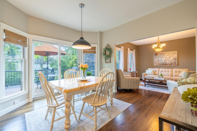 1050 Long Leaf Ct, Brighton, MI 48116 - dining space with wood finished floors, a chandelier, and baseboards