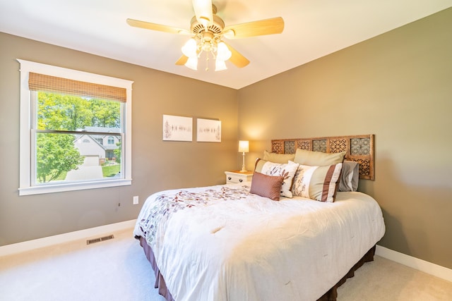 1050 Long Leaf Ct, Brighton, MI 48116 - bedroom featuring carpet, baseboards, and a ceiling fan