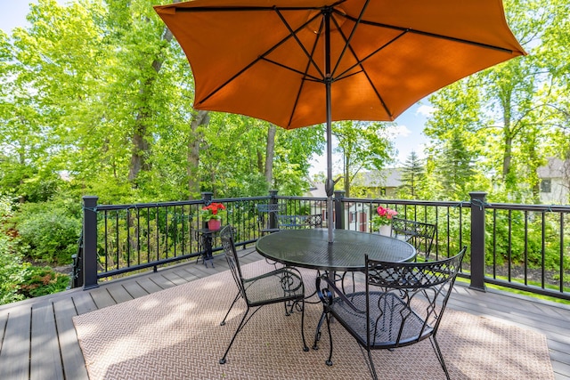 1050 Long Leaf Ct, Brighton, MI 48116 - wooden deck featuring outdoor dining area