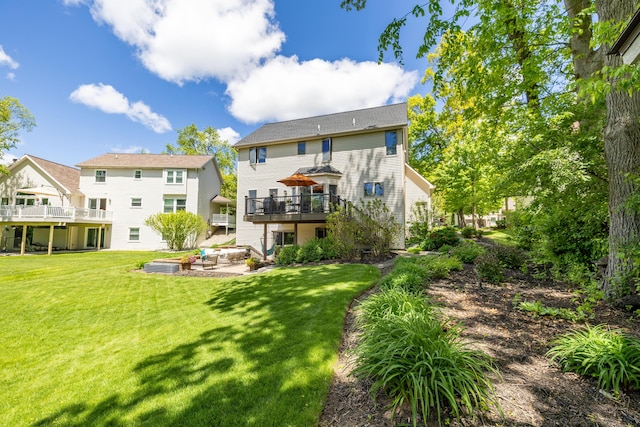 1050 Long Leaf Ct, Brighton, MI 48116 - back of house with a wooden deck, a lawn, and stairs