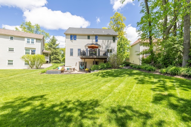 1050 Long Leaf Ct, Brighton, MI 48116 - rear view of property featuring a wooden deck, a lawn, and a patio
