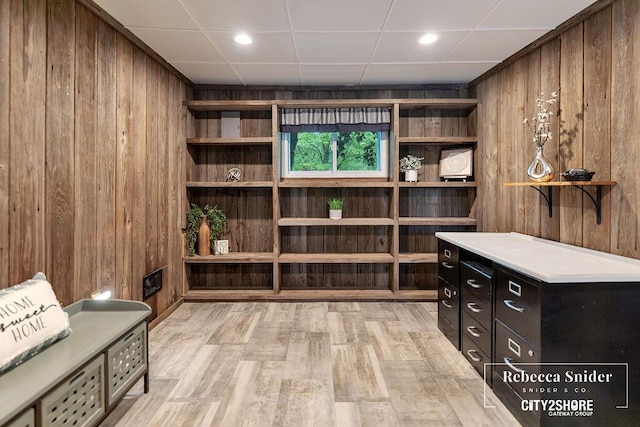 9409 Whitneyville Ave SE, Alto, MI 49302 - wine area with wooden walls and light wood-style floors